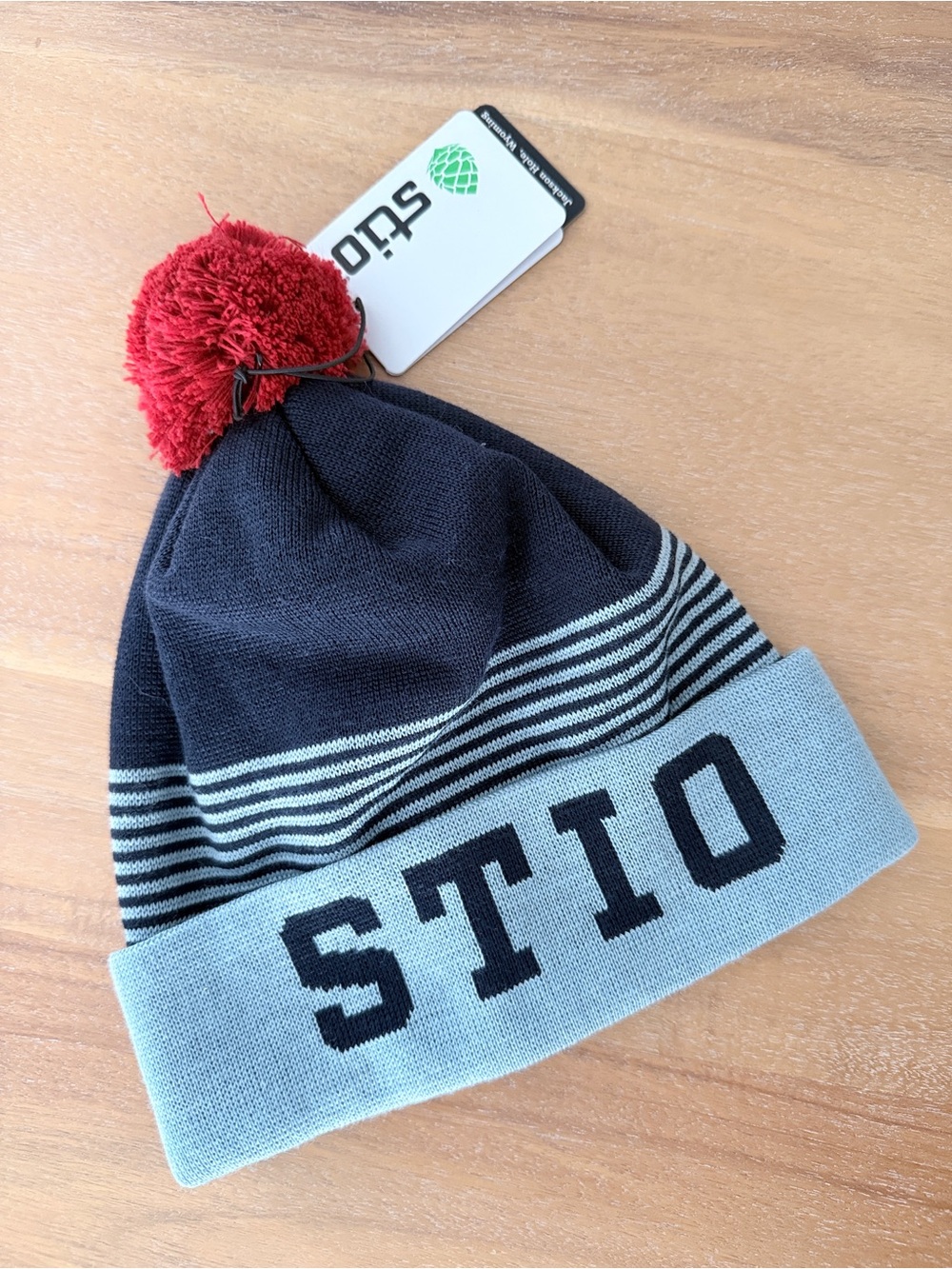 Stio Kids Beanie in Navy, Light Blue and Red Pom